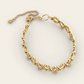 Flowing Cadence Bracelet with Blue Zircons in 18k Yellow Gold