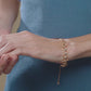 Flowing Cadence Bracelet with Blue Zircons in 18k Rose Gold
