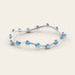 The Curve Bangle with Blue Zircons in 18k White Gold